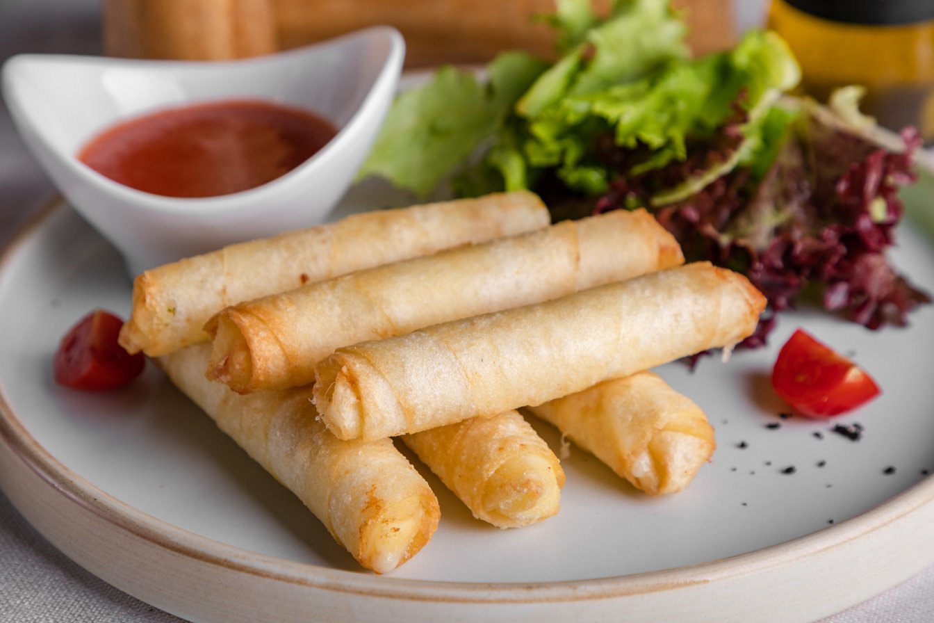 Spring Rolls On White Ceramic Plate